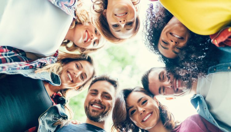 Group of friends in a circle smiling